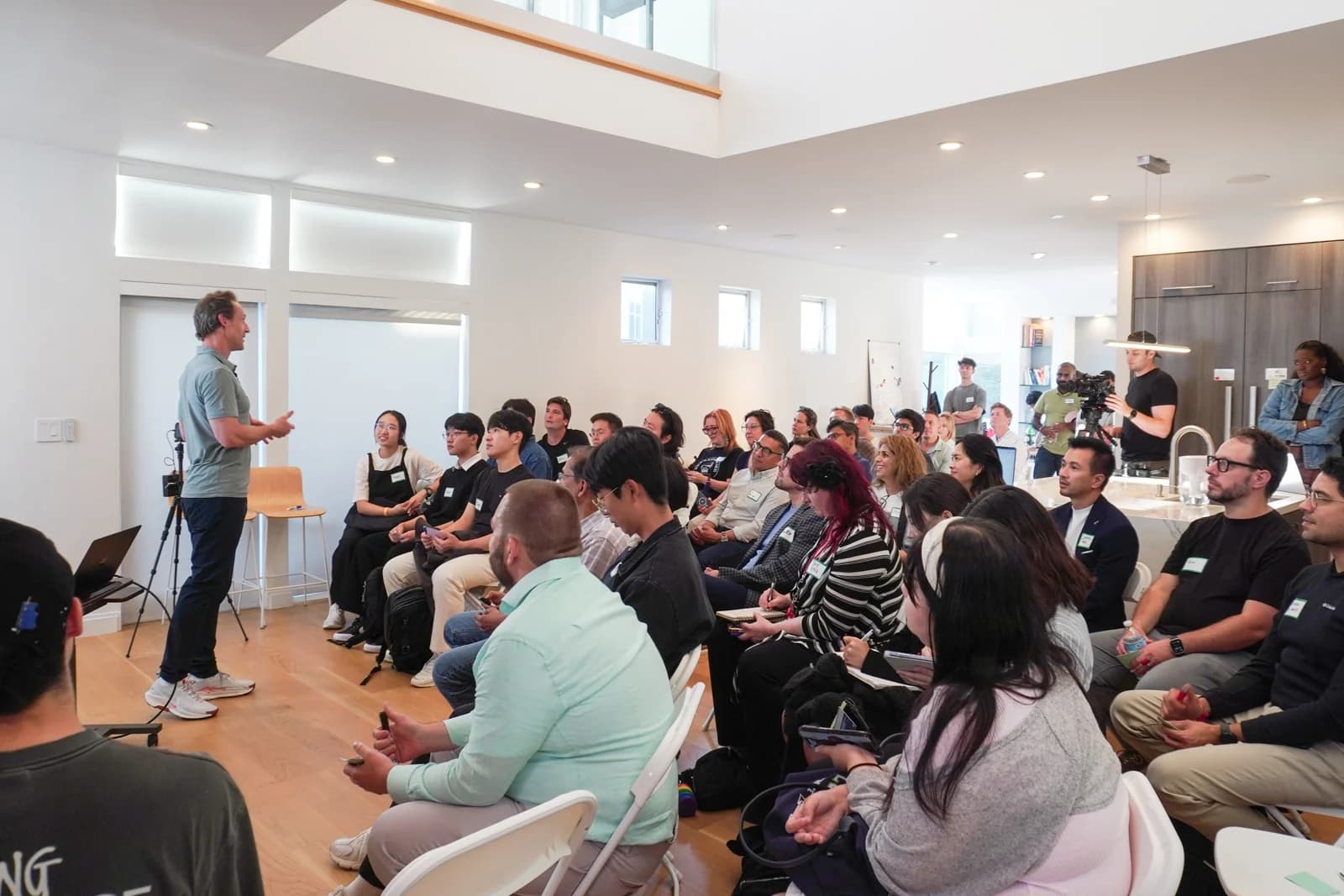 A speaker and audience at the EO × Mindstone AI Meetup at EO House in San Francisco.